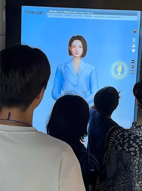 Visitors watching a digital human voice interaction display at the Osaka World Expo